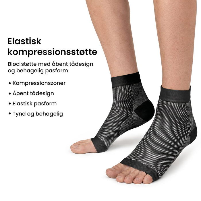 Sorte og hvide kompressionsstrømper med åben tå, 20–30 mmHg, til forbedring af blodcirkulationen.